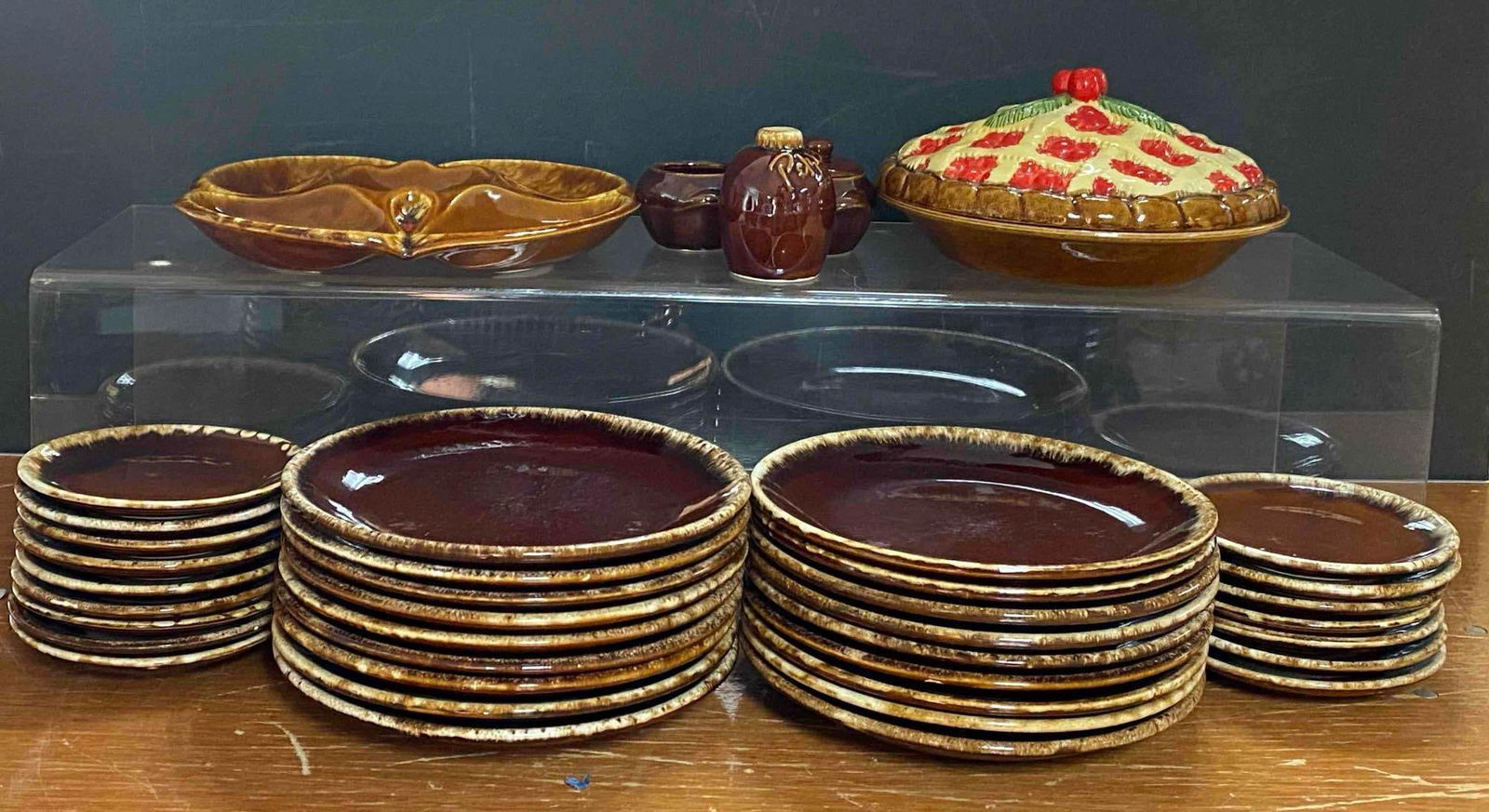 Group of McCoy Drip Glaze Plates and More: Includes cherry pie holder, chip and dip plate, jar and more, largest measures 2” H x 13” W