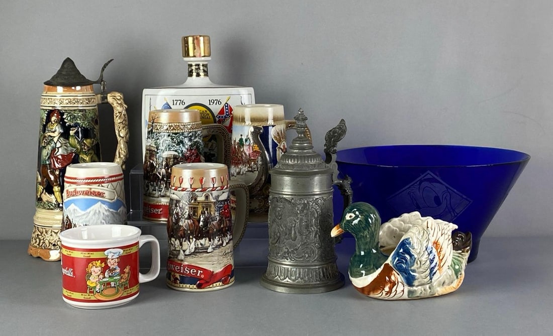 Group of Porcelain Steins and More: Includes Disney characters cobalt glass bowl, porcelain duck vase, metal stein and more, largest measures 6” H x 12” W