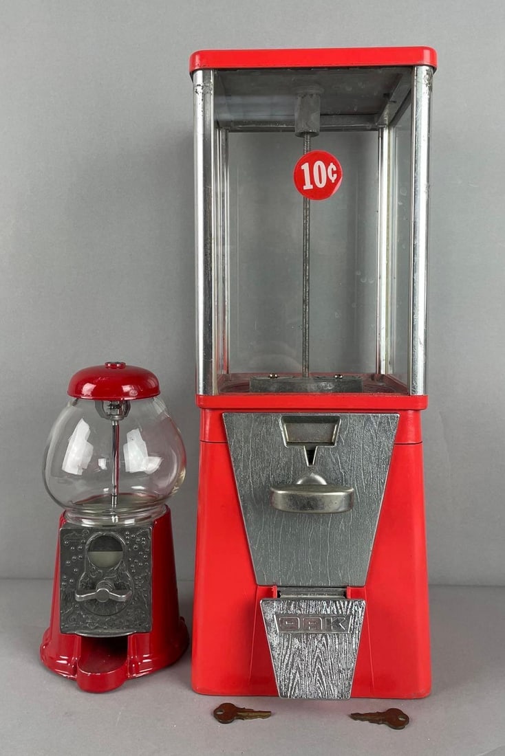 Group of 2 Gumball Vending Machines: Includes carousel nickel, oak dime with 2 keys, both in working condition, largest measures 17 1/4" x 6 3/4" x 7 3/4"