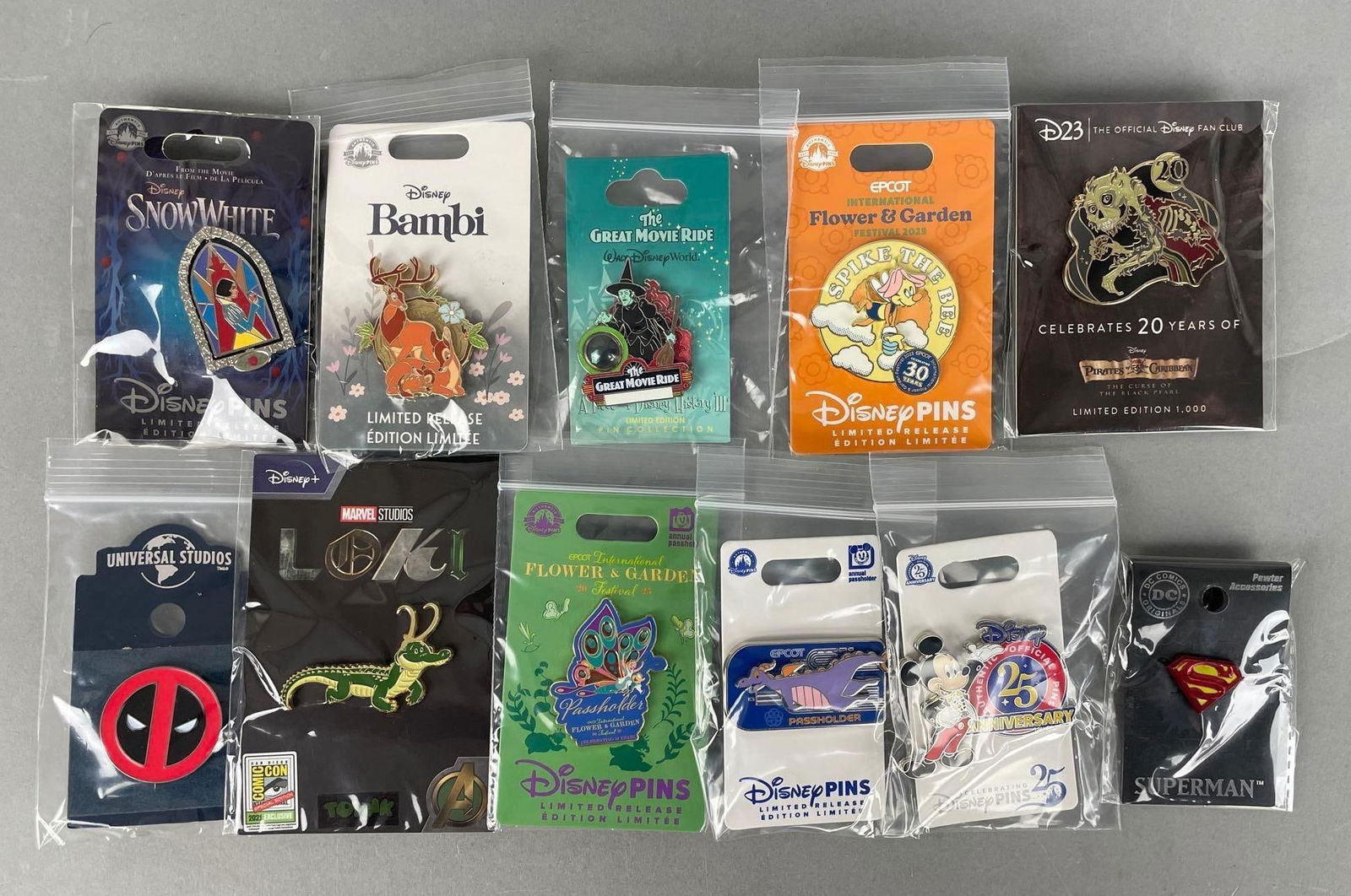 Group of Assorted Walt Disney Enamel Pins: Limited edition and limited release, includes Superman, 25th Anniversary, Deadpool