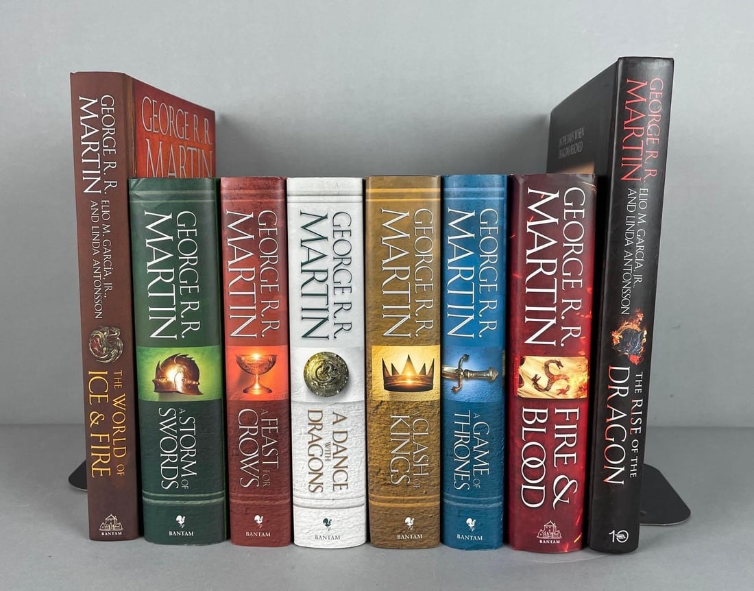 Group of George R.R. Martin Hardcover Books: Game of thrones, includes fire and blood, a dance with dragons, largest measures 12 1/4" x 9 1/4"