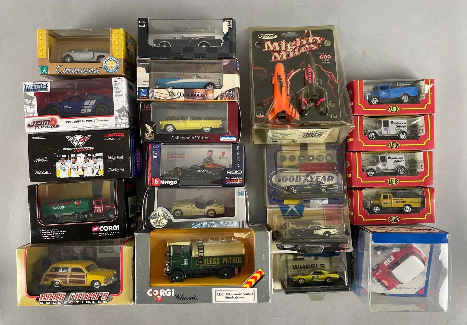 Group of Assorted Die-Cast Vehicles: Includes corgi classics, action corvette racing, 1/43 and 1/64 scale