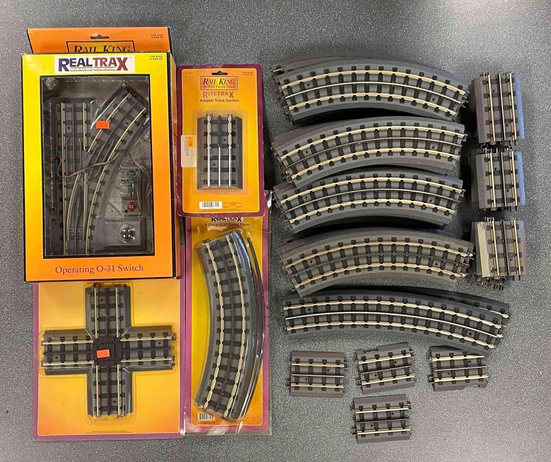 Group of Assorted MTH O Scale Train Tracks: Includes Operating switch, crossover, adapters and more, longest track measures 15” in length
