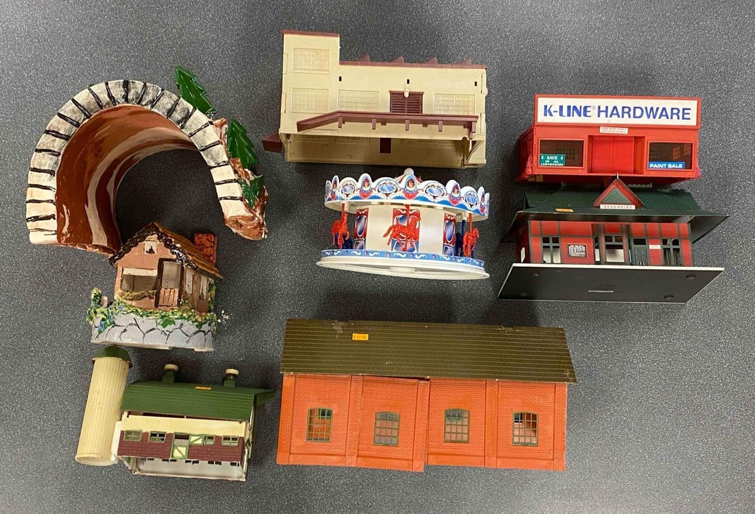 Group of Model Train Buildings: Includes K-Line Hardware, handmade pottery tunnel, pottery house and more, largest measures 7” H x 9” W x 11” D