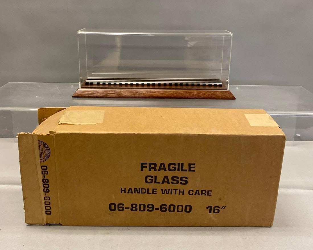 Group of 2 16?? O Scale Display Cases: like new in original packaging. One Box measures H 9 x W 6 x L 18 inches. Stand not included.
