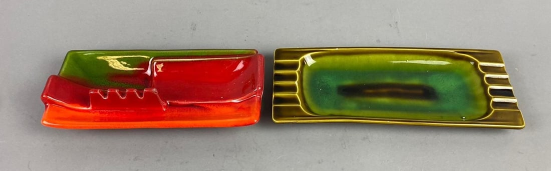 Group of 2 MCM Glazed Ceramic Ashtrays: Made in California and Japan. Largest measures L 10 x W 4 inches.
