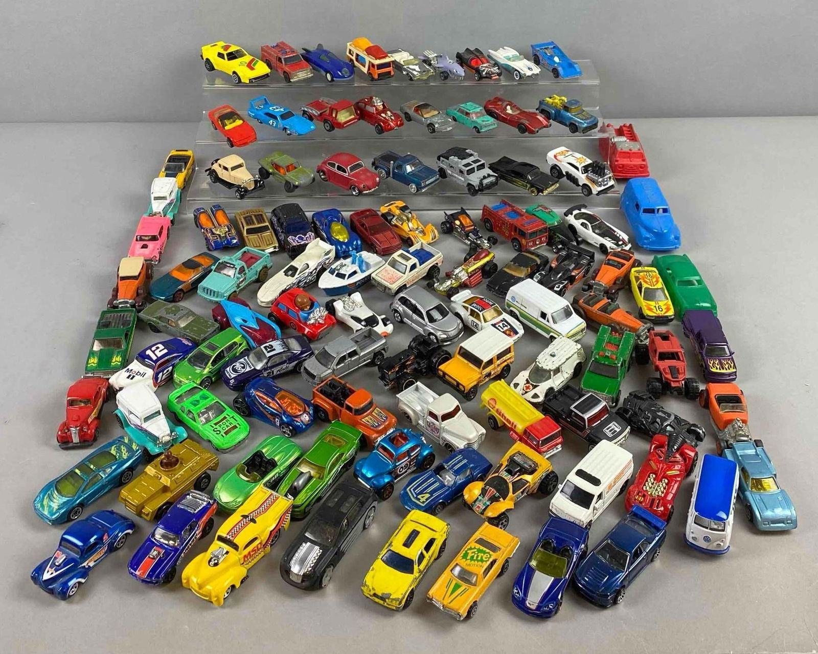 Group of Assorted Mattel Hotwheels Die Cast Vehicles and More: Includes toy shack Volkswagen,Shell truck, and more. Largest measures 3” stand not included.