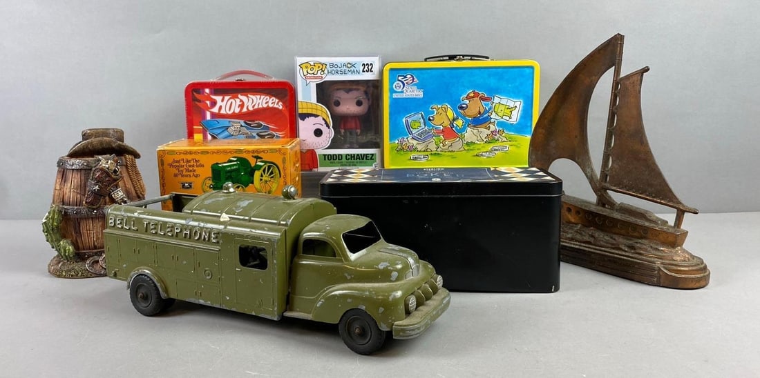 Group of Miscellaneous Items: Includes Sterling Goods Texas Hold Em Poker set, Bell Telephone toy truck, and more. Largest item measure 12” in length. Stand not included.