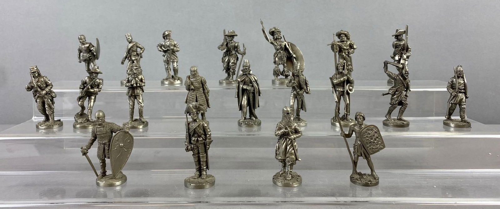 Group of 20 Franklin Mint Soldier of the World Great Army Figures: Includes crusader, Roman soldier, and more. Largest measure 2” in length. Stand not included.