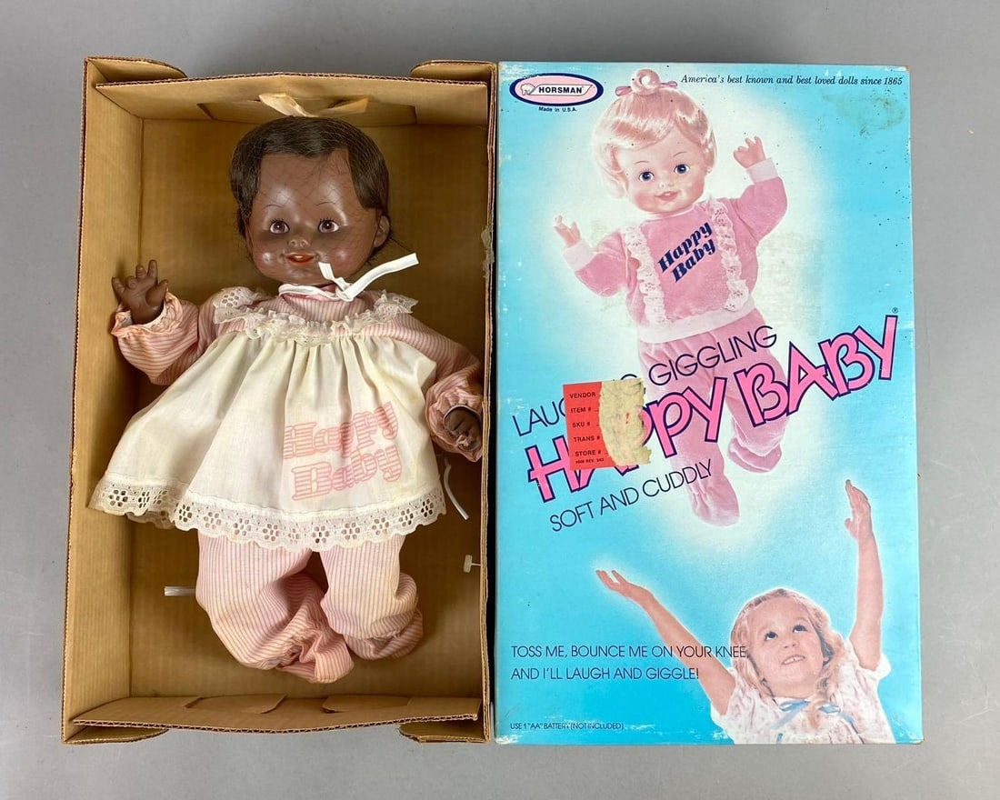 Vintage Happy Baby Doll: Laughing, Giggling, Soft, and Cuddly Doll made by Horsman Dolls New York, USA. Measures H 15 1/2 x W 4 x L 9 1/2 inches.