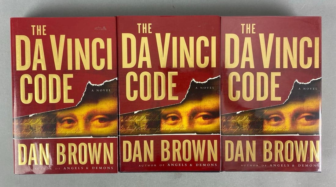 Group of 3 First Edition The Da Vinci Code By Dan Brown Hardcover Books: One signed by Emily S Brown, each measures 9 1/2” H x 6 1/2” W