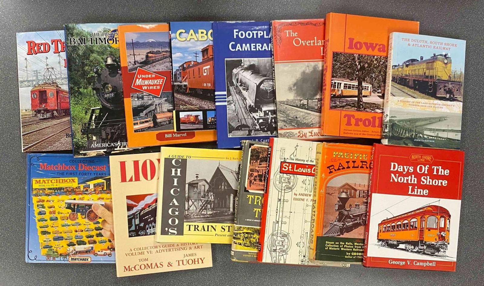 Group of Train Hardcover Books and More: Includes Lionel, Days of the north line shore, collecting matchbox and more, largest measures 10 1/2” H x 10 1/2” W