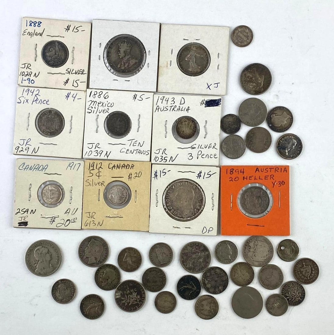 Group of 40 World Currencies: Includes 1943 Australia SILVER 3 Pence, 1886 Mexico SILVER 10 Centavos, and more.