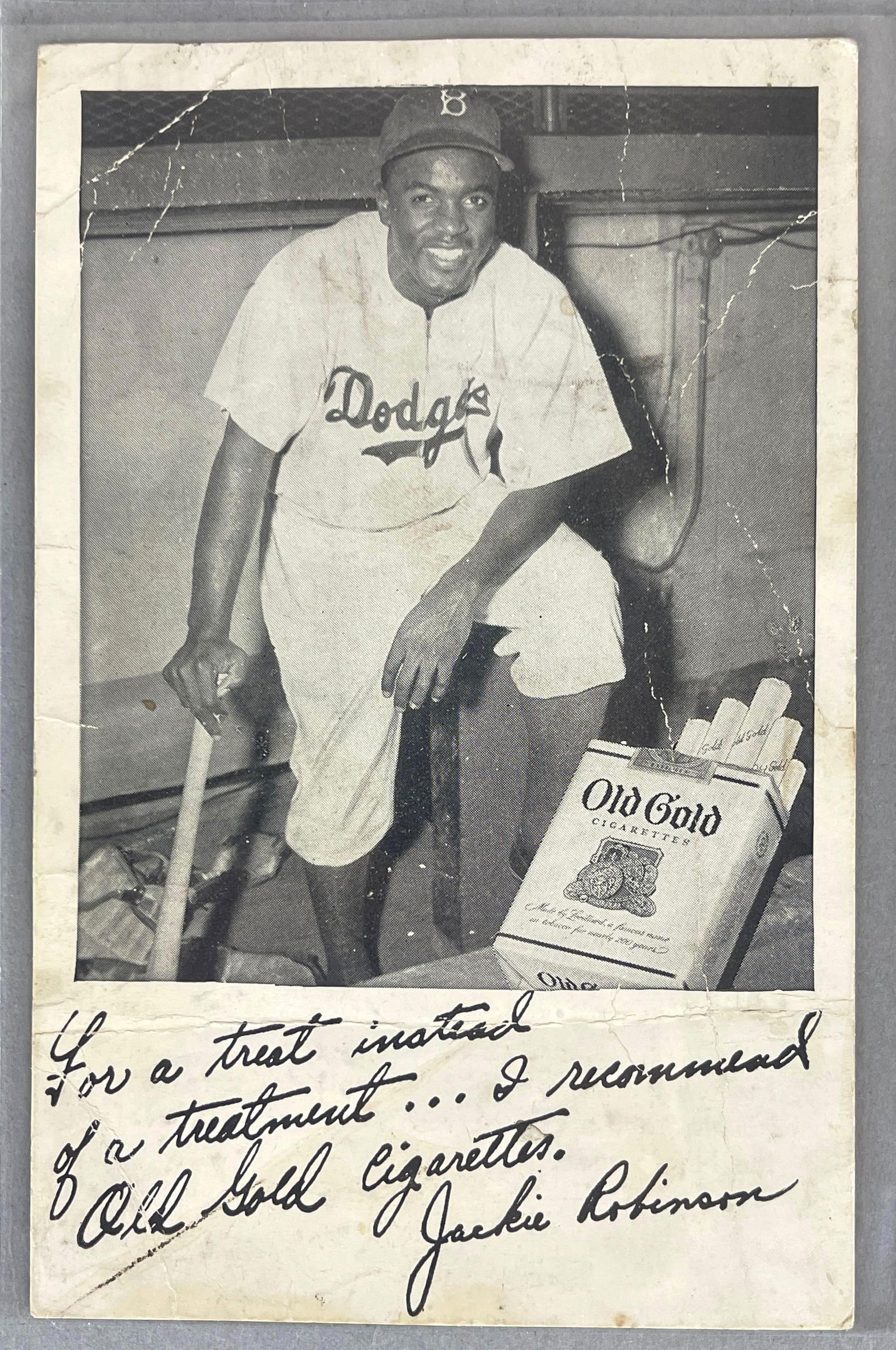 Rare 1948 Old Gold Cigarettes Jackie Robinson Rookie: Kneeling in dug out version, Condition low, Measures 3 1/2 x 5 1/2 Inches
