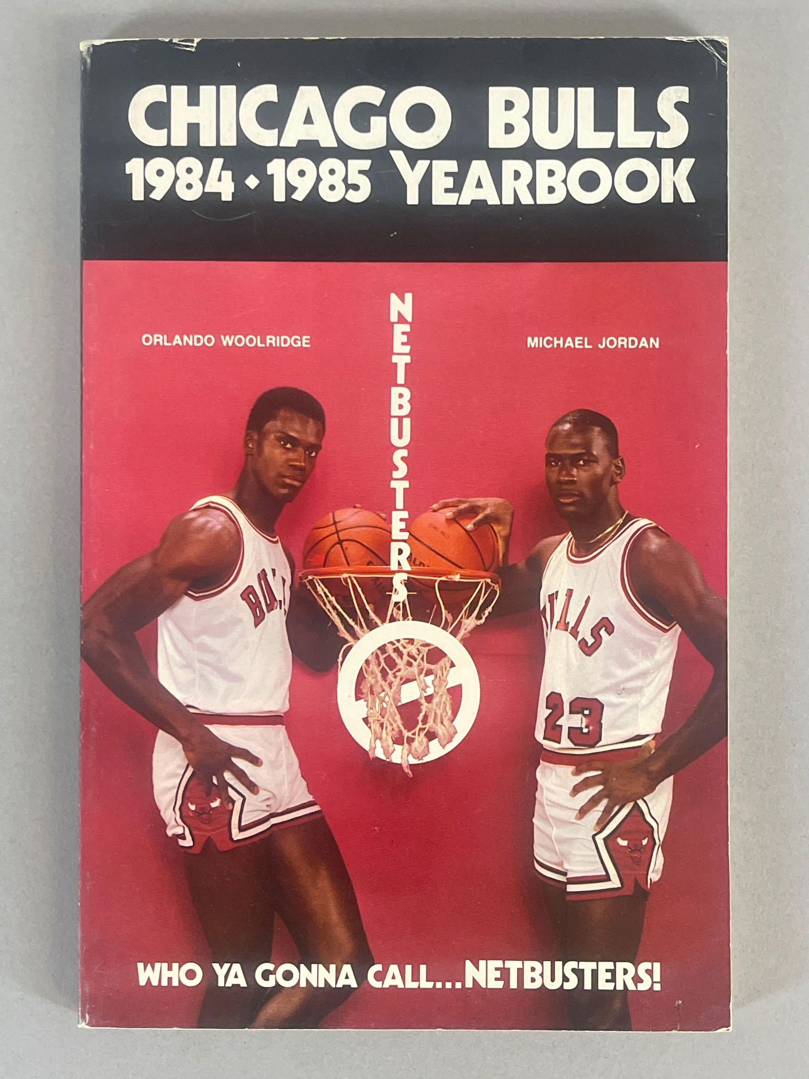 1984 - 85 Chicago Bulls Yearbook with Michael Jordan on Cover Rookie Year: 1984 - 85 Chicago Bulls Yearbook with Michael Jordan and Orlando Woolridge on Cover, Measures 5 3/4 x 8 1/2