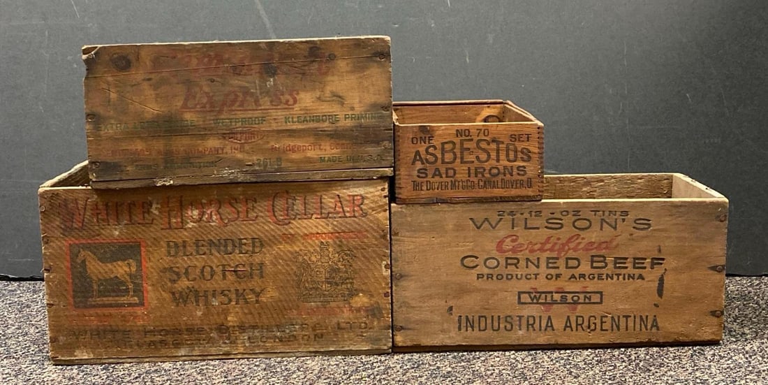 Group of 4 Antique Wood Advertising Crates: Includes Remington, Wilsons Corned beef, White Horse Cellar scotch and Asbestos sad irons, largest measures 9” H x 16 1/4” W x 12 1/2” D