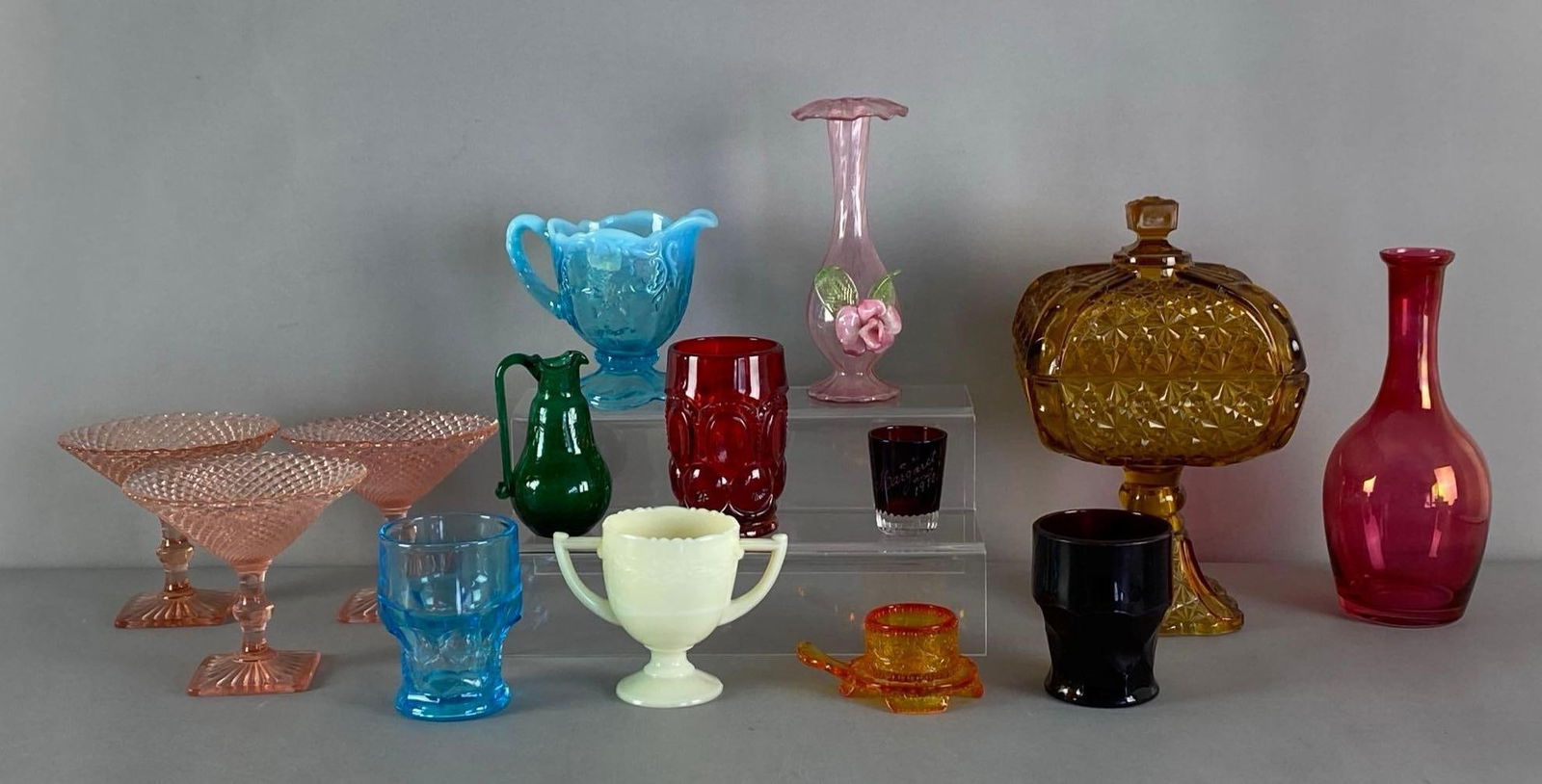 Group of Assorted Glass Items: Includes vase, toothpick holder, sugar and more, largest measures 11” H x 6 3/4” W x 6 3/4” D