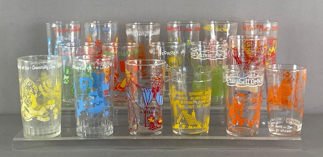 Group of Vintage Character Glassees: Includes The Wizard of Oz, speedy Gonzalez, Fred Flintstone and more, largest measures 5” H x 2 1/2” W