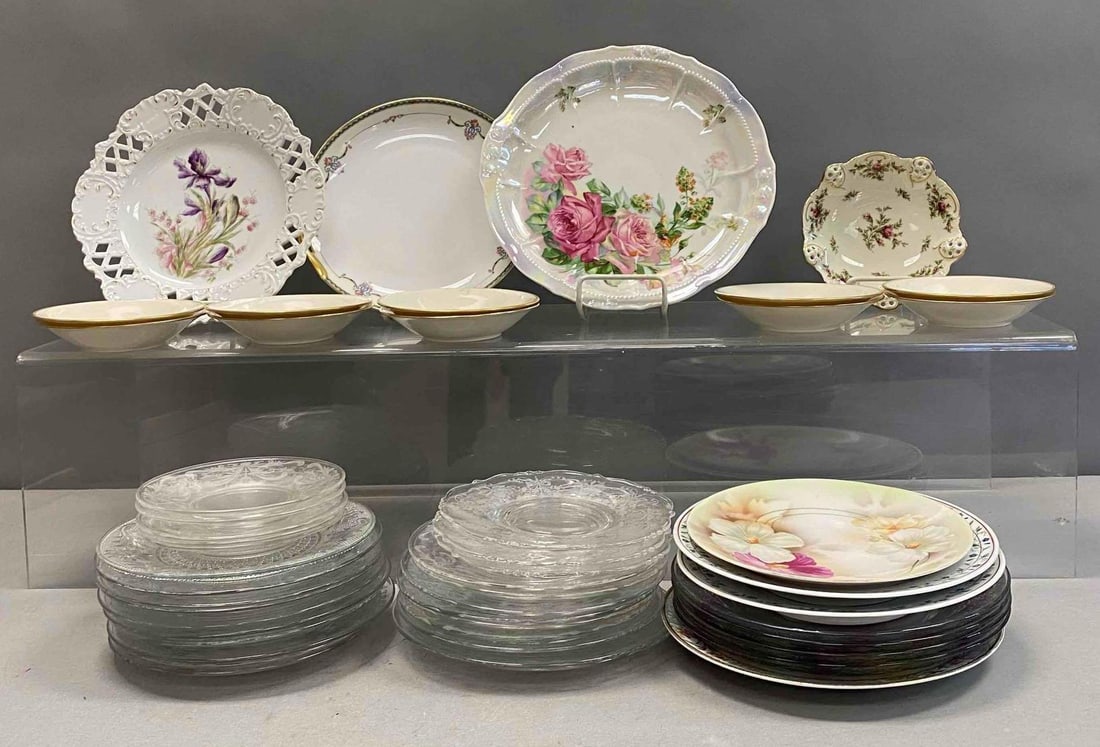 Group of Assorted Fine China Plates and More: Includes serving plates, saucers, and more. Largest plate measures 11” in diameter. Stand not included.