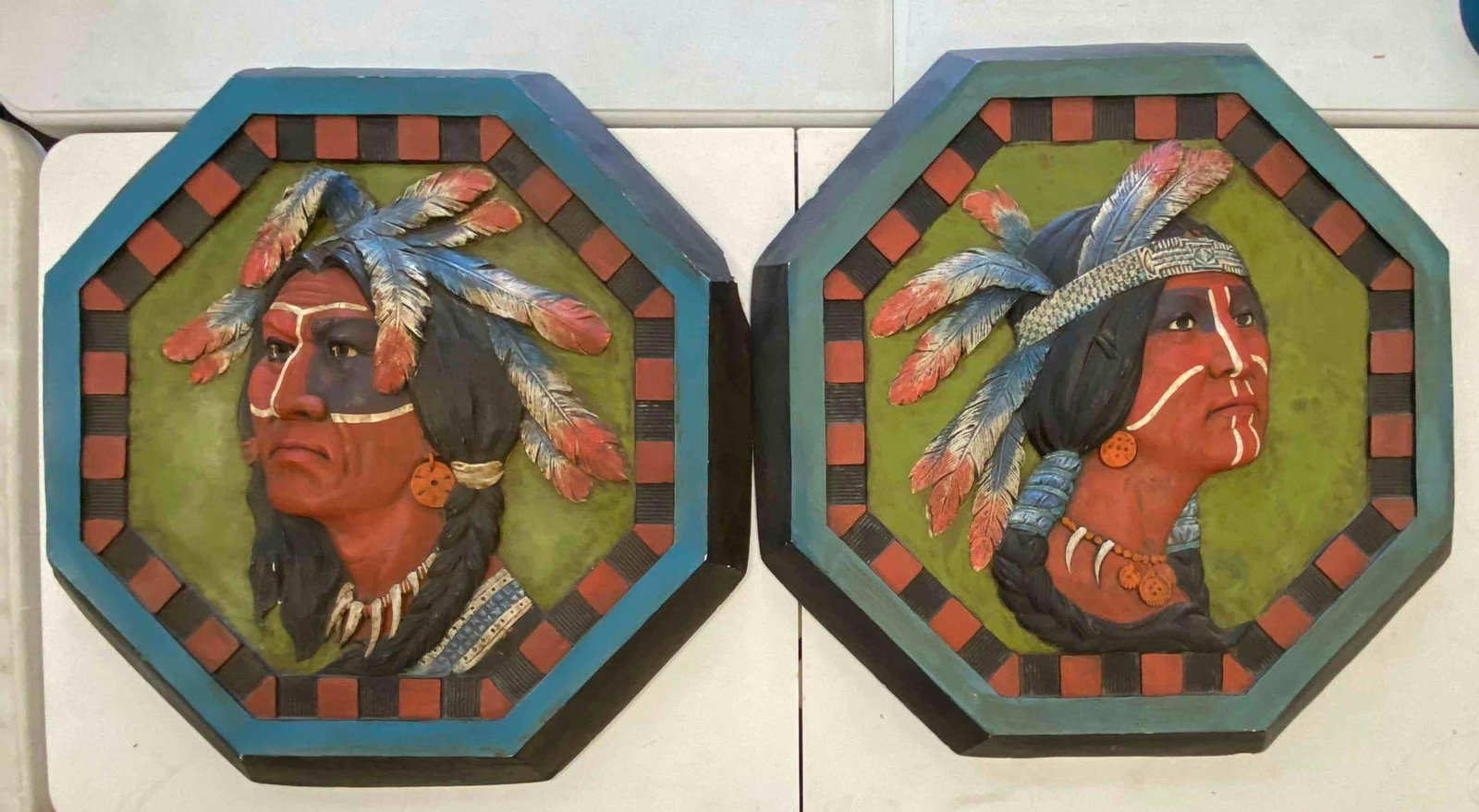 Group of 2 Native American Plaster Wall Art: One has chip on side. One measures L 28 x W 27 inches.
