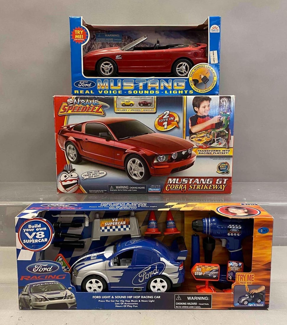 Group of 3 Ford Racing Model Cars and More: Includes Ford Mustang, Nsane Speedeez Mustang GT Cobra Strikeway, and more. Largest measures H 8 x W 5 x L 21 inches. Stand not included.