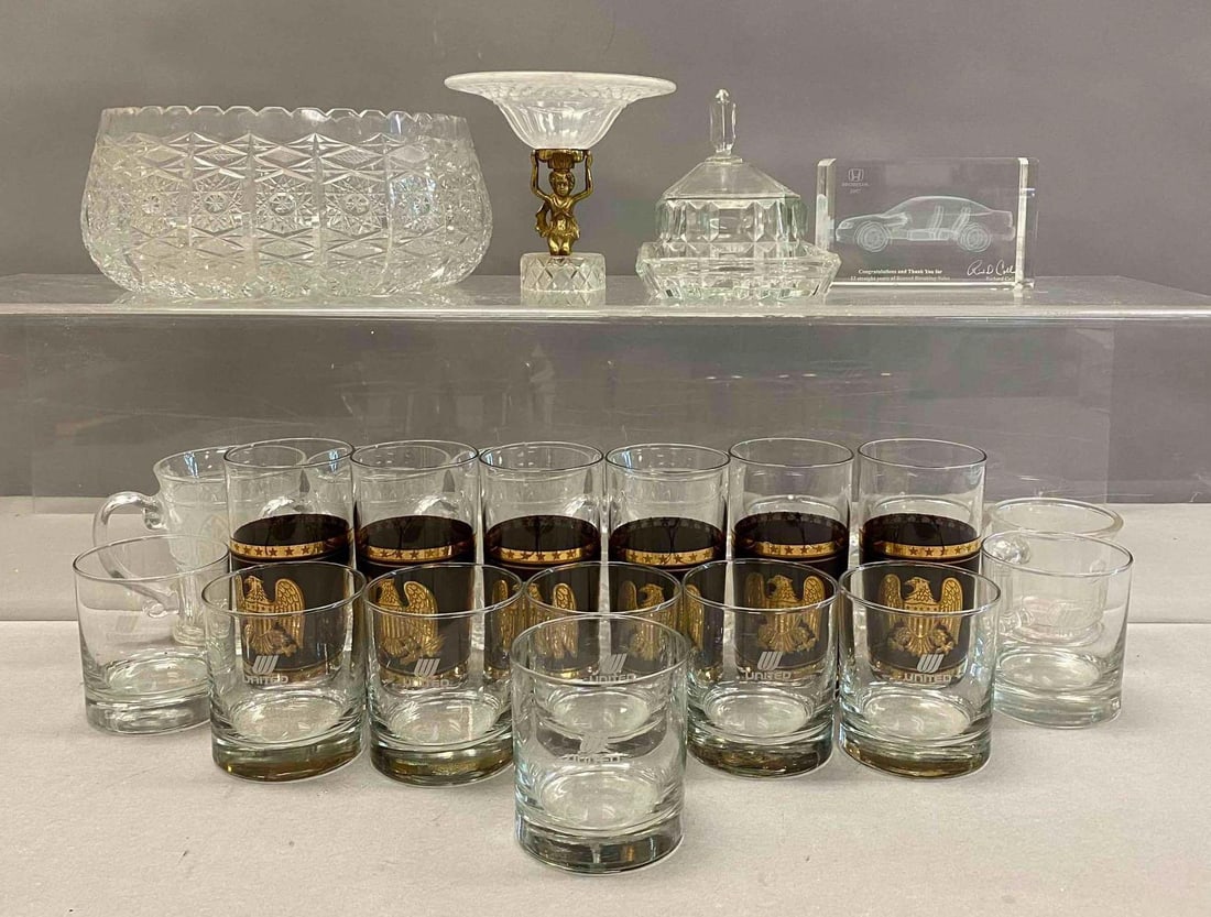 Group of Assorted Drinking Glasses and More: Includes Federal Eagle Glasses, United Airlines Whiskey Glasses, and more. Largest item measures H 5 x W 10 inches. Stand not included.