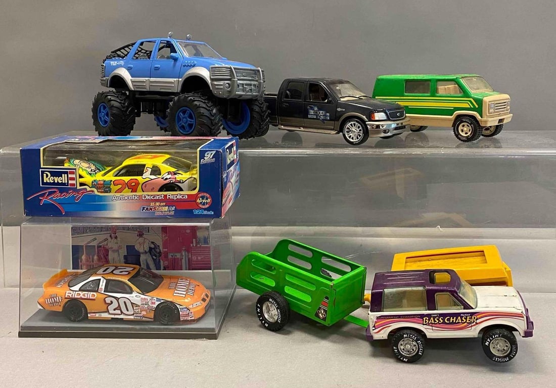 Group of Assorted Die Cast Vehicles and More: Includes Becker and Sons F150 Truck, Tonka Van, and more. Largest measures H6 1/2 x W 6 1/2 x L 12 inches. Stand not included.