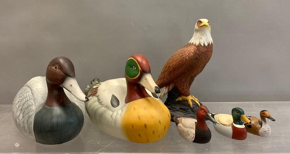 Group of Assorted Avon Collectors Duck Series Ceramic Ducks and More: Includes 2 Larges ducks, Pride of America Avon Eagle, and more. Largest measures H 5 x W 4 1/2 x L 11 inches. Stand not included.