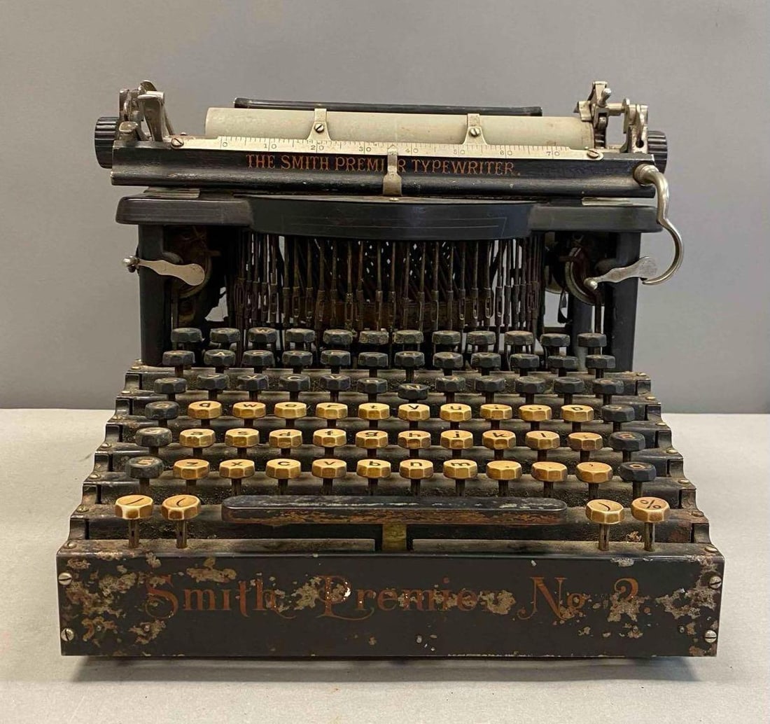 Antique Smith Premier No. 2 Typewriter: Tested. Most keys work, some stick. Will need new Ribbon and cleaning. Paint chips throughout. Measures H 9 x W 10 1/2 x L 13 inches.