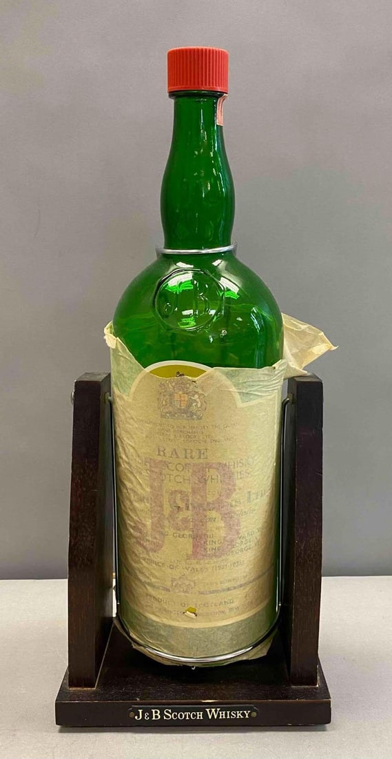 Vintage J and B 1 Gallon Scotch Whisky Decanter and Holder: Bottle is empty and wrapped in protective paper. Measures H 20 x W 5 x L 8 1/2 inches.