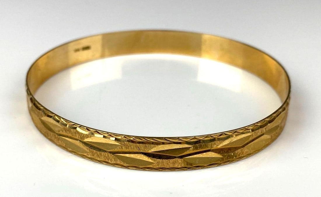 Signed Vios 14K Yellow Gold Etched Bangle Bracelet: Total weight 13.3 grams. Interior Measures 8 inches around.