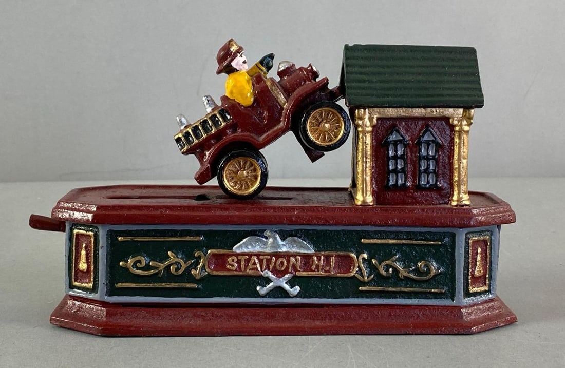 Reproduction Cast Iron Station H.I Firemen Mechanical Coin Bank: Movement does not function, measures 5 1/2” H x 9” W x 3” D