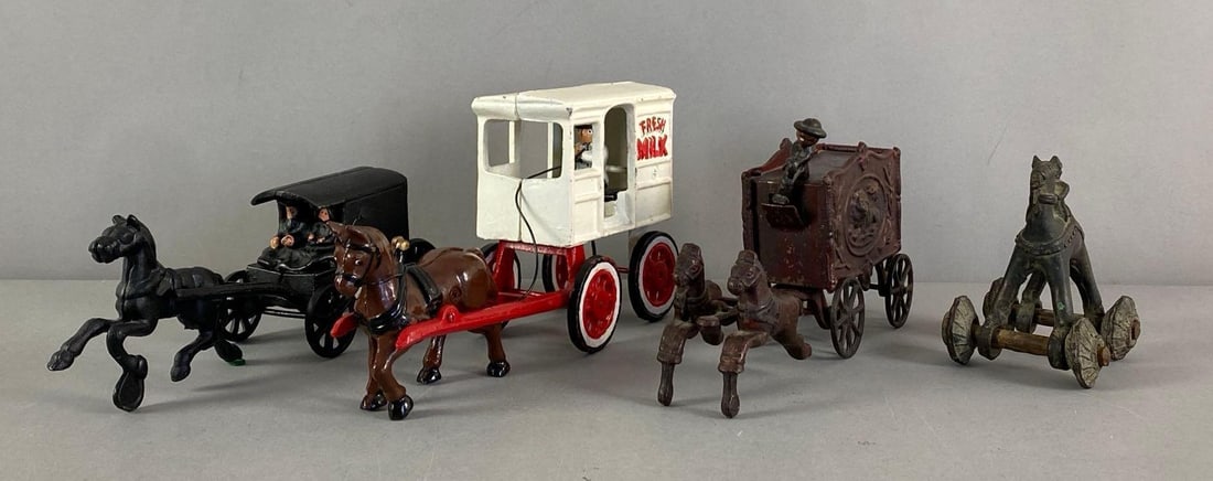 Group of 4 Reproduction Cast Iron Horse Toys: Includes 3 horse drawn carriages and 1 horse On wheels, largest measures 5 1/2” H x 3” W x 11” D