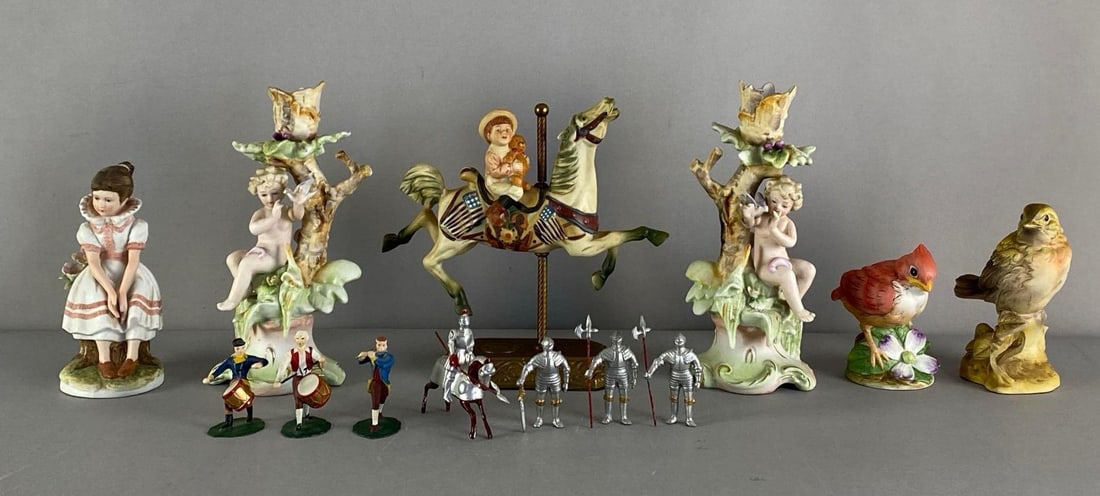 Group of Porcelain and Metal Figurines: Inclufed knights, military drummers, porcelain bird figurines and more, largest measures 7 1/2” H x 7” W x 3 1/2” D