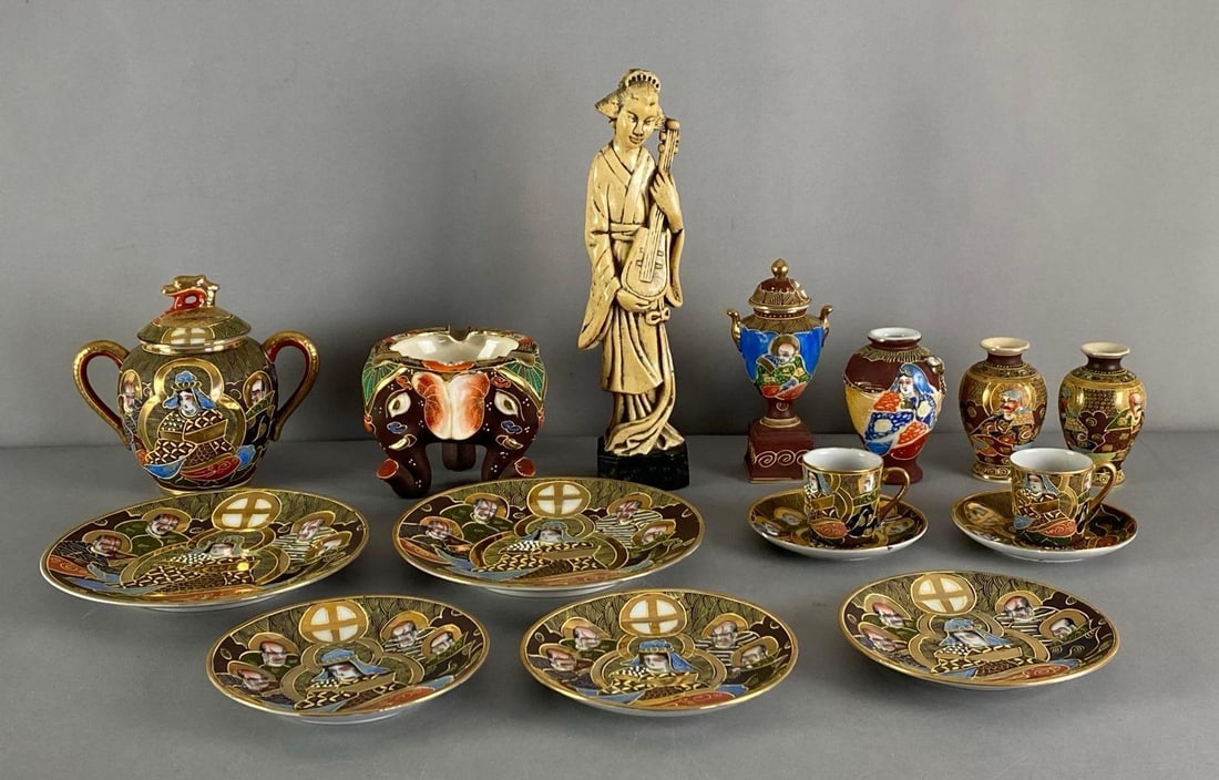 Group of Japanese Satsuma Style Porcelain Items and More: Includes ashtray, plates, teacups, wood Figurine and more, most marked on base, largest measures 11” H x 3” W x 2” D