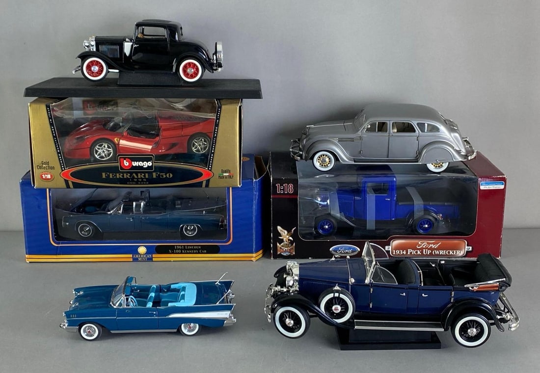 Group of 7 Die-Cast Cars: Inclufed 1961 Lincoln X-100, 1934 ford pick up, Ferrari F50 and more, some missing pieces and damage to boxes, largest is 1/18 scale