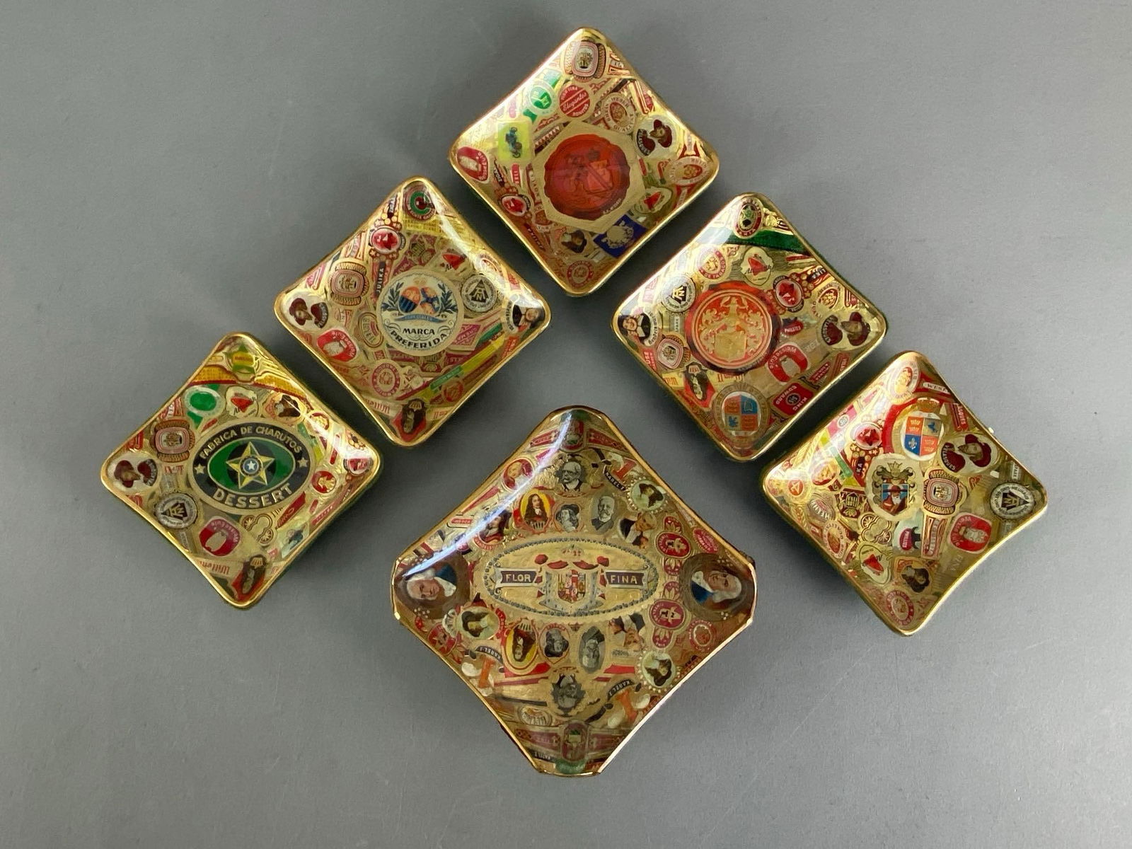 Group of 6 Vintage Handmade Cigar Label Ashtrays: Felt bases, largest measures 5@ H x 5” W x 1” D