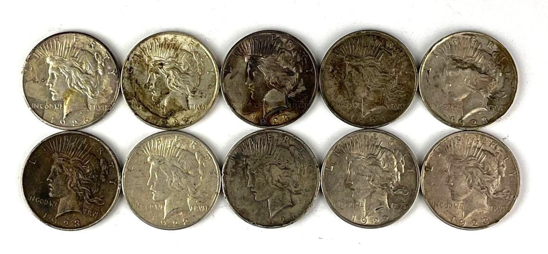 Group of 10 US Peace Silver Dollars: Includes years 1937, 1923, 1922 and more.