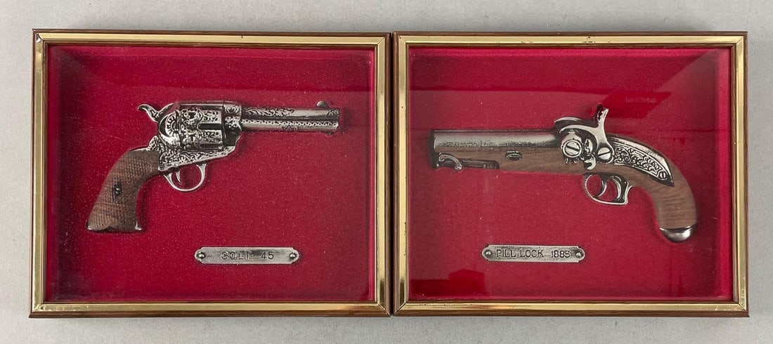 Group of 2 IIC Replica Pistol Wall Plaques: Includes Colt .45, 1885 pill lock, 8" x 10" displays
