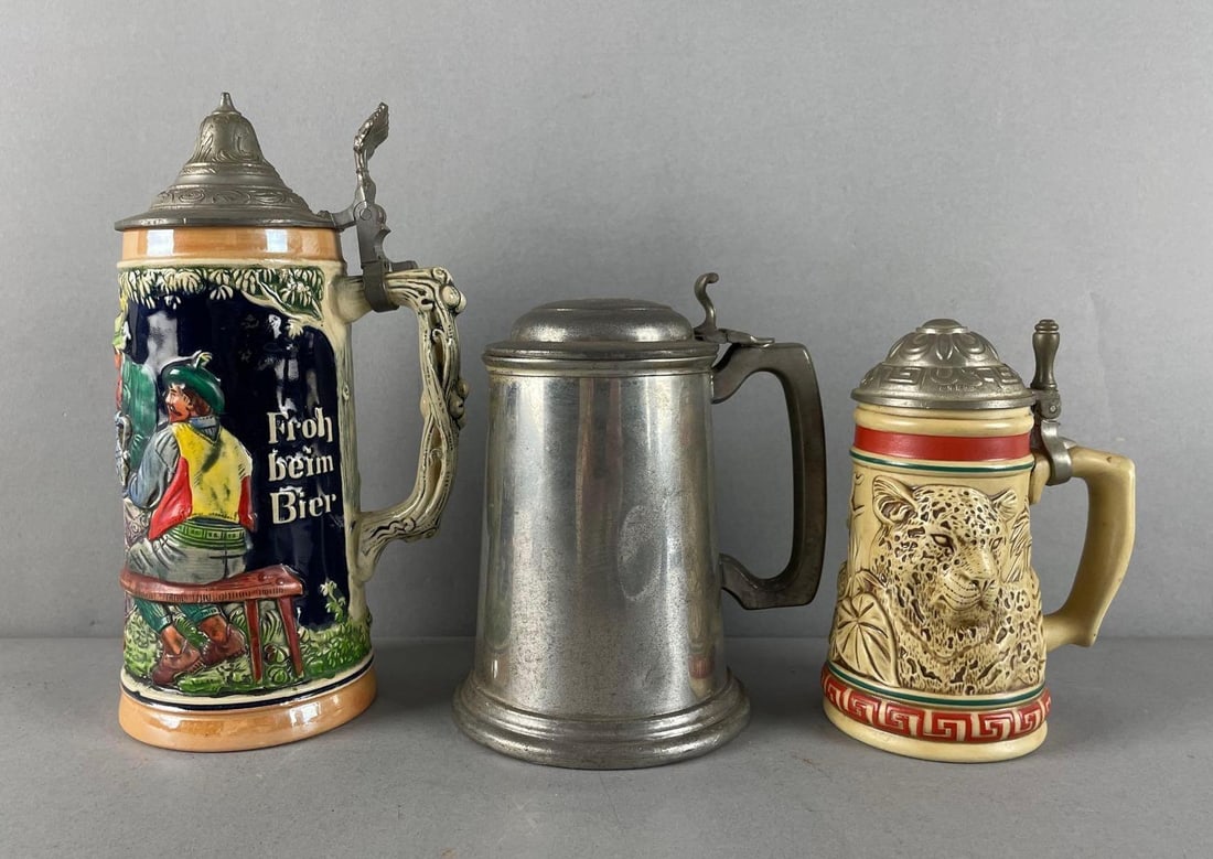 Group of Lidded Beer Steins: Includes Sheffield pewter, Avon endangered species Jaguar, German stein measures 8 1/2"