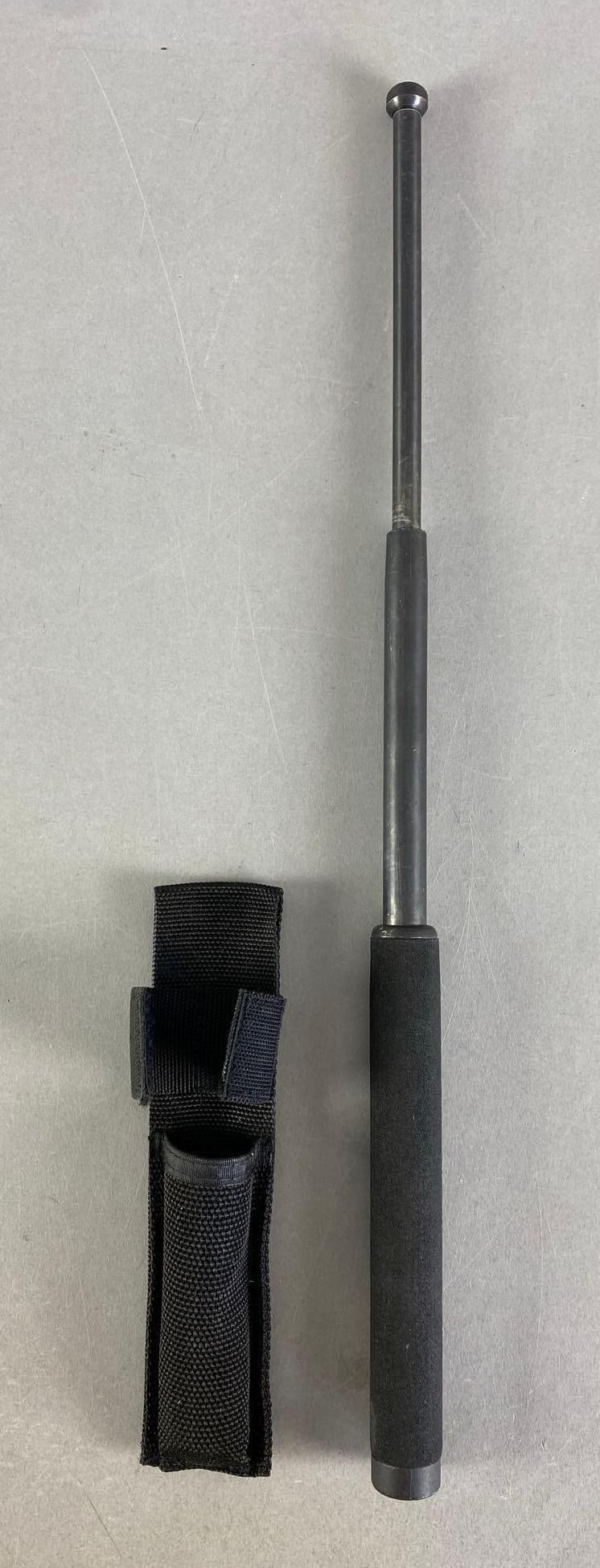 Steel Expandable Baton with Sheath: Measures 21” in length while expanded