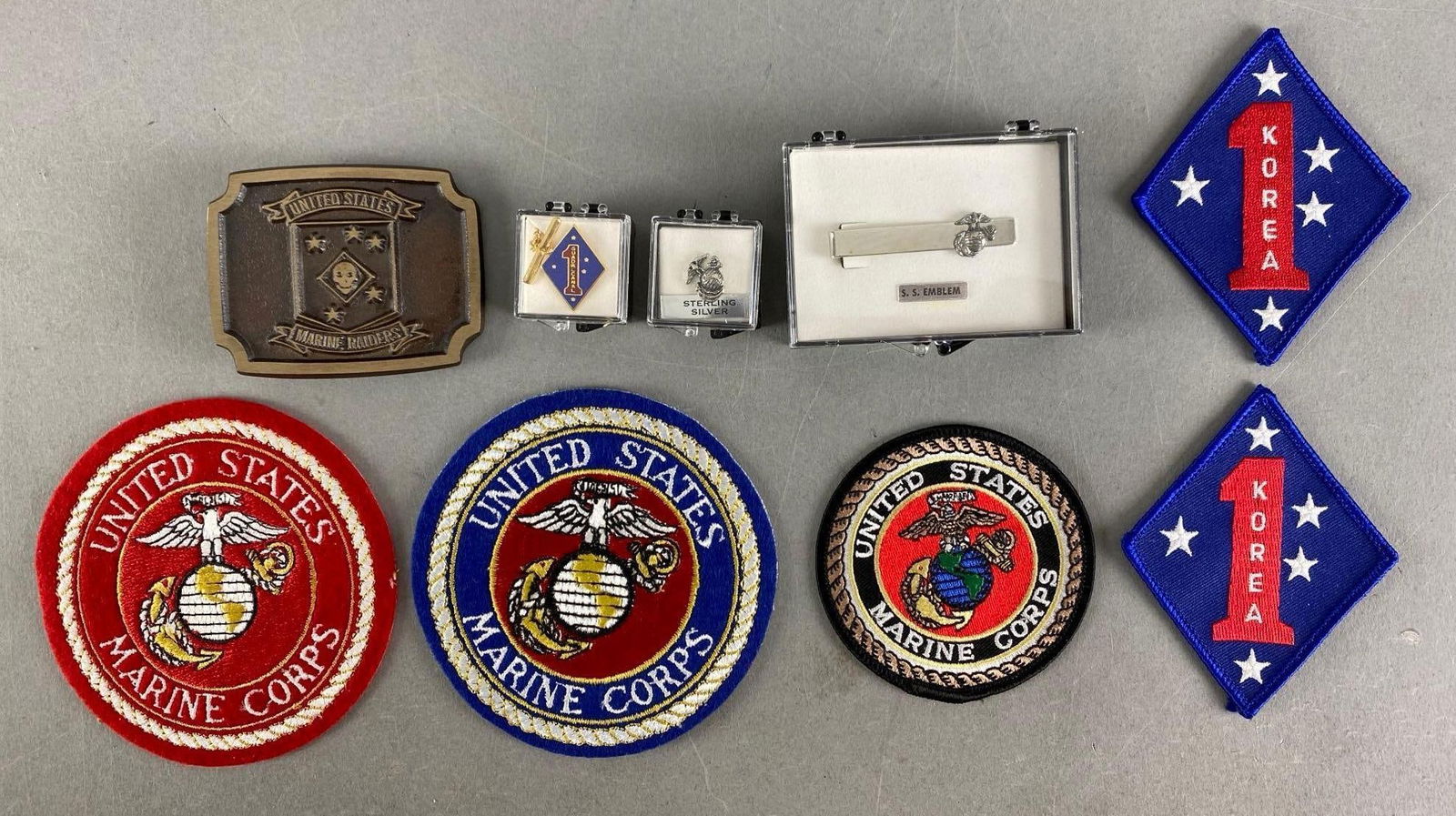 Group of United State Madine Corps Patches and More: Includes Sterling Silver Emblem Pin, tie clip, tie pin and belt buckle, largest measures 4” in diameter