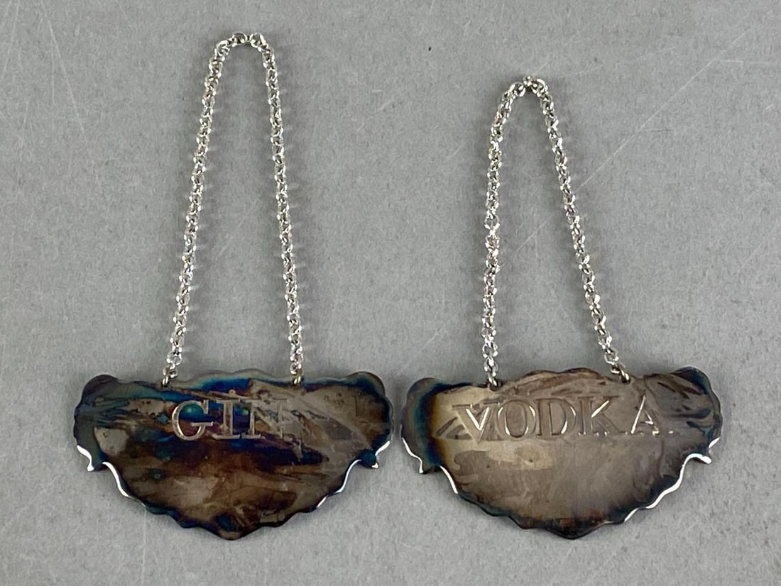 Group of 2 Williamsburg Stieff Silverplate Liquor Decanter Tags: both marked on reverse, largest measures 4 1/2” H x 2 1/2” W