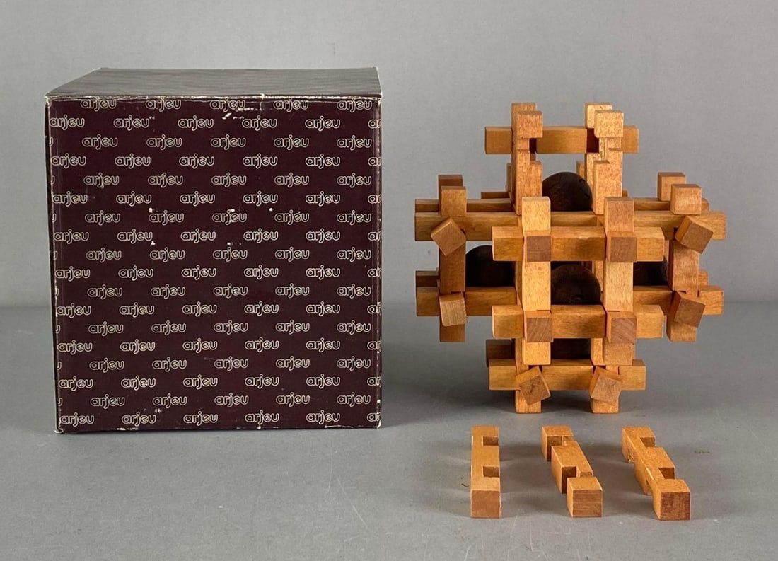Arjeu Brain Teaser Many Ball Wood Puzzle: CT-61, complete set in original box, not fully assembled, puzzle measures 6 3/4” H x 6 3/4” W x 6 3/4” D