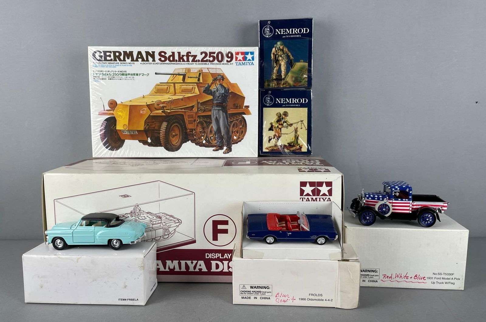 Group of Die-Cast Vehicles and Model Kits: Includes Tamiya display case, wellys, 1/35 scale German tank kit