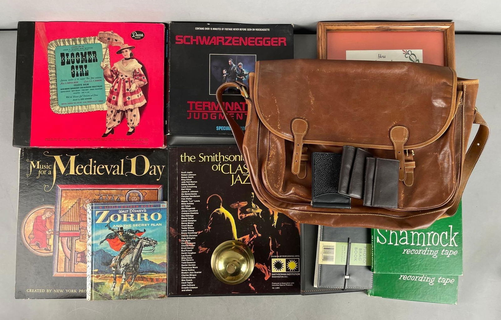 Group of Vinyl Records and More: Includes T2 judgment day vhs, leather bag, UofI stadium seat, jazz cassettes