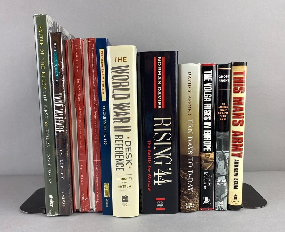 Group of Assorted Historical Military Books: Includes Rising 44, Battle of the Bulge, and more. Largest book measure L 11 x W 9 inches. Bookends not included.