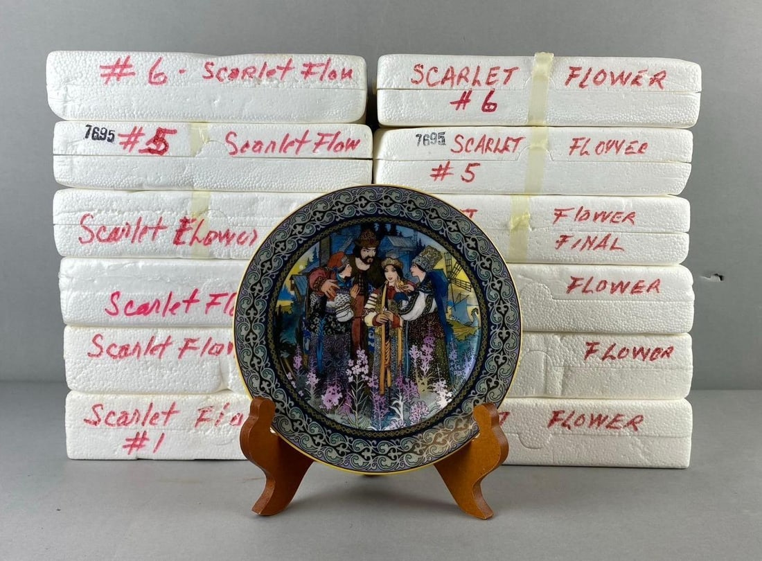 Group of 12 The Bradford Exchange Russia Scarlet Flower Plates: Includes Merchants farewell, magic ring, and more. One plate measures 7 1/2” in diameter. Plate stand not included. Like new in original packaging.