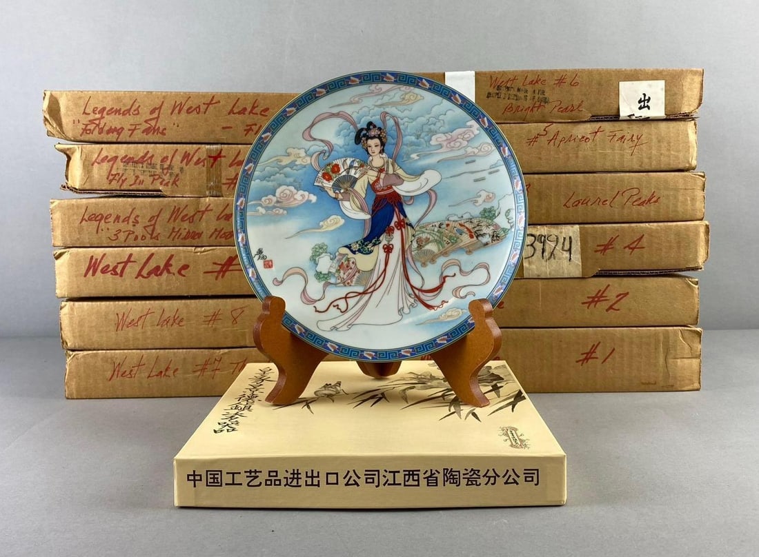 Group of 12 The Bradford Exchange Legends Of West Lake Plates: Includes Bright Pearl, Fly in peak, and more. One plate measures 8 1/2” in diameter. Like new in original packaging. Plate stand not included.