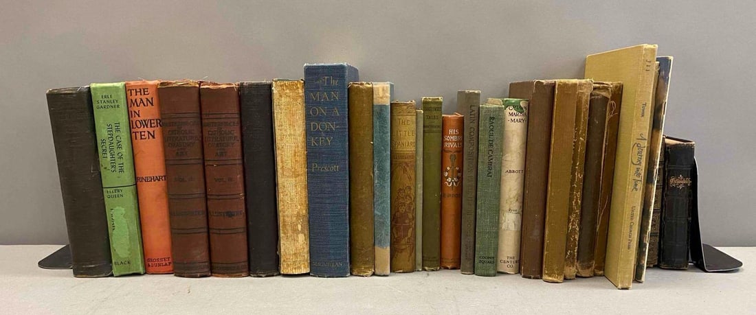 Group of Assorted Vintage Books: Includes The Little Spaniard, The Man on a Donkey, and More. Largest book measures L 9 x W 7 inches. Bookends not included.